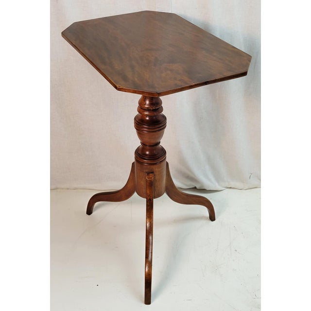 This exquisite 19th-century American Federal-style cherry candle stand table is a captivating example of refined...