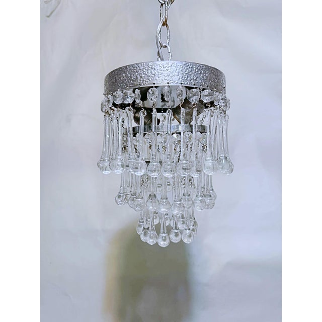 Elevate your interior styling with the icy glamour and shimmering brilliance of this vintage three-tier crystal waterfall...