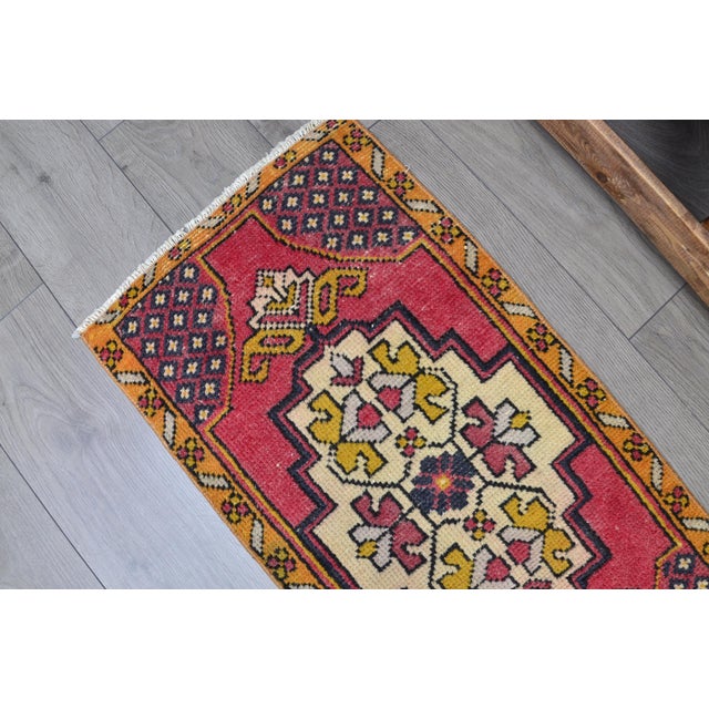 This is a vintage Turkish Oushak rug from the 1960s. The piece was hand-knotted.