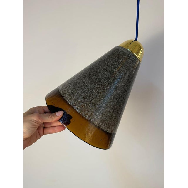 A piece of German glass art: This brown pendant lamp by Peill & Putzler captivates with its handcrafted design and...