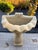 A spectacular Italian style wall fountain with Gorgon head, made of three pieces of limestone. Subtle veins of golden and...