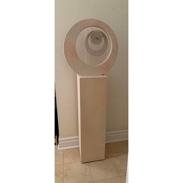A monumental vintage postmodern pedestal floor clock that functions equally well as sculpture and timepiece. Standing 64...