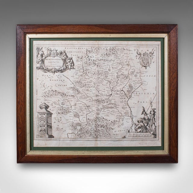 This is an antique county map of Hertfordshire. A Dutch, framed atlas engraving of cartographic interest by Joan Blaeu...
