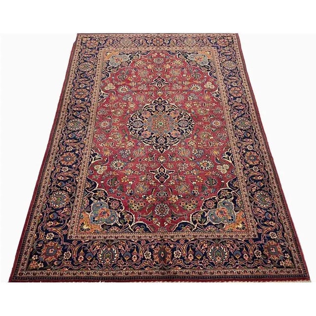 ACTUAL SIZE: 4’5″ x 7’0″ PRIMARY COLOR: Navy / Red AGE: Old MATERIALS: Wool FOUNDATION: Cotton PRODUCTION: Handwoven,...