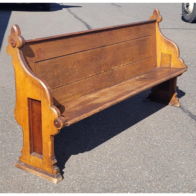 Nice and long antique church pew. Made of solid oak with paneled sides and fleur-de-lis corners. Measuring 81 in Long by...