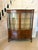 Antique Edwardian quality burr walnut display cabinet having a pair of burr walnut serpentine shaped glazed doors opening...