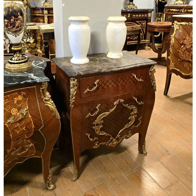 Elegant French Louis XV style nightstand or side cabinet featuring a luxurious marble top, fine parquetry inlay, and...