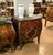 Elegant French Louis XV style nightstand or side cabinet featuring a luxurious marble top, fine parquetry inlay, and...