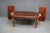 A Thomasville attributed cherry dining table featuring an oval top with a satin finish, subtle banded inlay, and turned,...