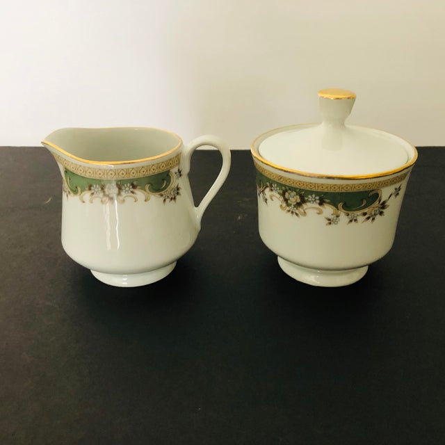 Elegant Sugar and Creamer Set, makers mark reads “ Fine porcelain by accord Canada” Excellent condition.