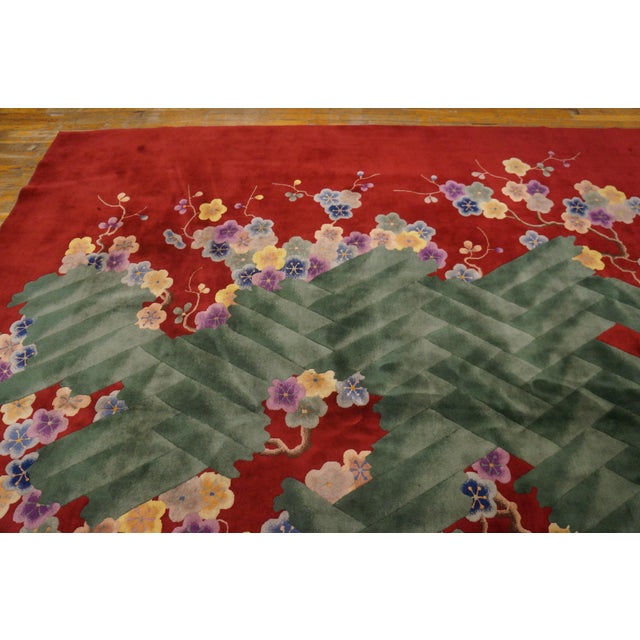 Antique Art Deco Large Room Size Wool Claret Rug, Circa Date: 1920s. This exceptional piece captures the aesthetic zenith...