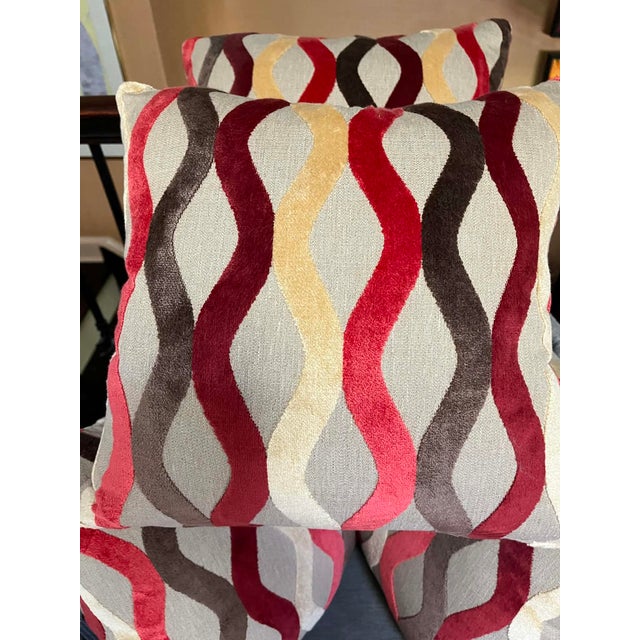 Beautifully made throw pillows, set of four, including the feather down inserts. Zipper closure on all four pillows....