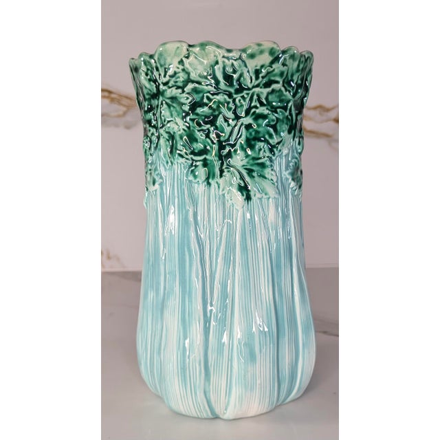 Majolica celery vase with turquoise stalks, green tops and pink interior. No makers mark is visible but attributed to the...