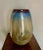 Stunning 13” high art glass vase in hues of gold, blue and amber Bent sides and cracked finish Great for a modern,...