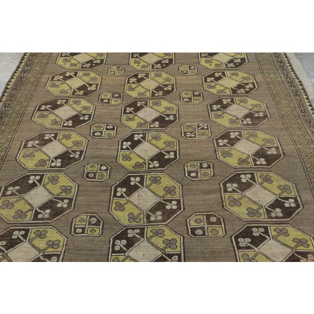 This vintage 6x7 Bokhara rug originates from Russia, dating back to 1940-1960. Hand-knotted in robust wool, it showcases a...