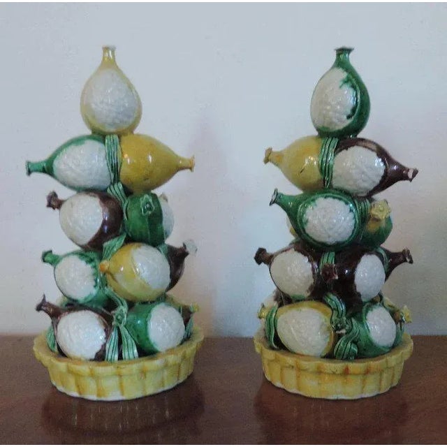 Pair Chinese famille vert polychrome temple fruit altar pyramids in shades of brown, green, white and yellow. Each...