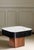 Crafted with sleek ceramic top with rounded edges, black wood side and bronze metal base, this coffee table combines...