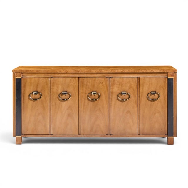 American of Martinsville Mid Century Walnut, Burlwood and Brass Credenza This credenza measures: 68 wide x 19 deep x 31...