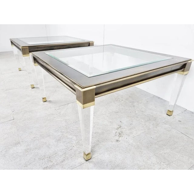Gorgeous pair of acrylic glass and brass side tables or coffee tables with a clear glass top. Good overall condition....