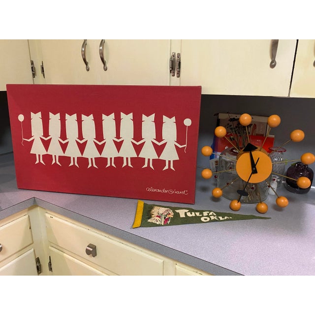 A wonderful original Alexander Girard design for Herman Miller in 1972. It depicts paper doll girls in dresses with bows...