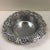 The Artnur Court grape and leaf wine coaster is made of aluminum and the measurements are 6 1/4 inches wide by 2 1/4...