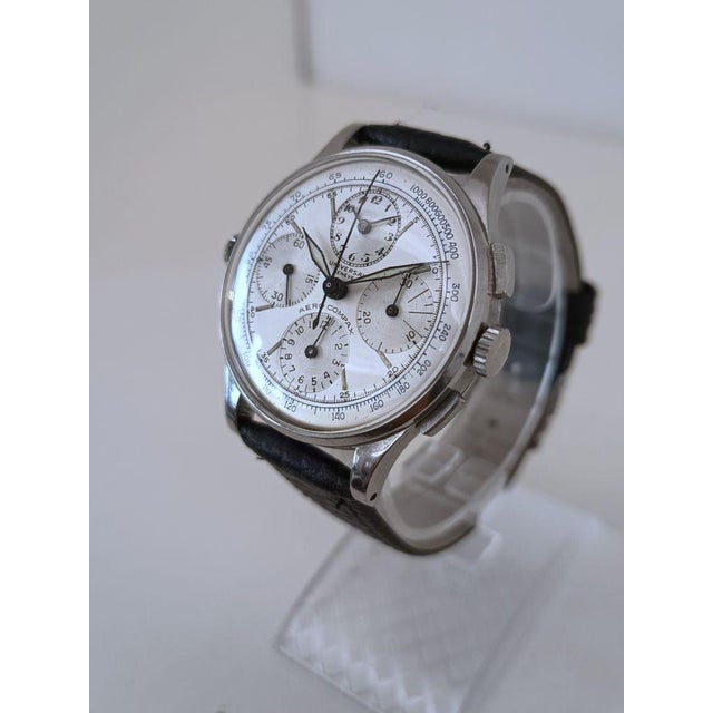 Brand Universal Model Aero-compax Year 1950-59 Movement Manual winding Movement type Universal 287 Case Steel Dial White...