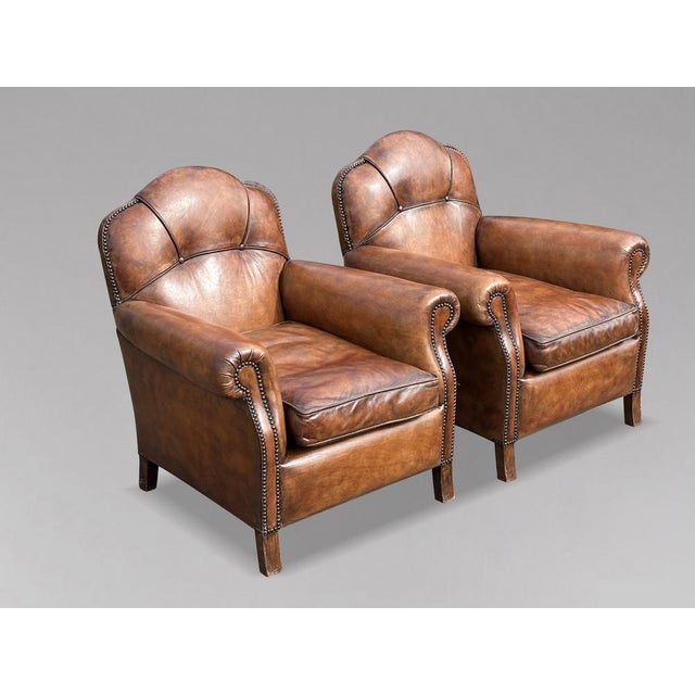 Pair of Mid 20th-Century French Brown Leather Club Armchairs A superb pair of mid 20th-century French leather club...
