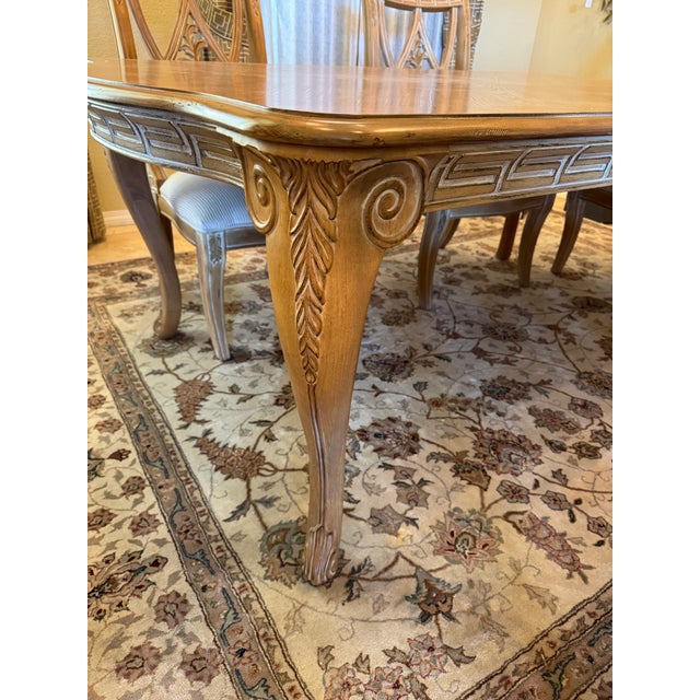 Bernhardt Dining Table with two extension leaves, two Armchairs and four Side chairs Beautiful craftsmanship on this fine...
