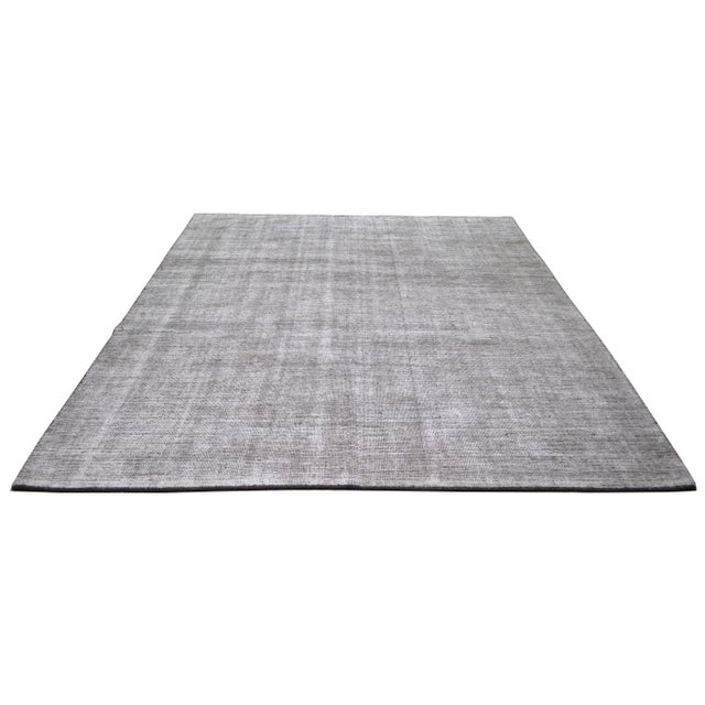 Made using traditional rug making techniques, this wool rug blends timeless craftsmanship with a modern approach to...