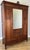 An elegant Antique French walnut mirrored wardrobe showcasing timeless craftsmanship, refined proportions and beautiful...