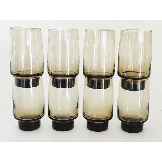 Offered is a set of 8 highball tumblers from Libbey Glass in their iconic mid 20th century Tawny Accent color, a sunken...
