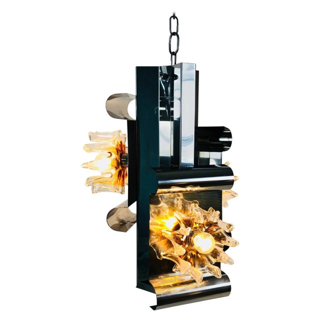 A beautiful Murano glass hanging lamp made in Italy in the 1970s. The light is made of thick Murano. It has an amazing...