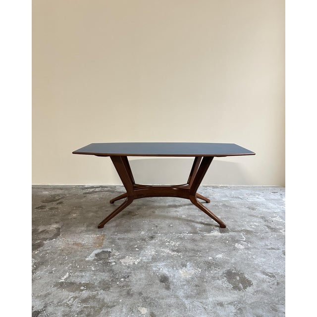 Table with petrol blue Formica top, 1960s, Italian manufacture. The petrol blue Formica top features rounded corners and a...