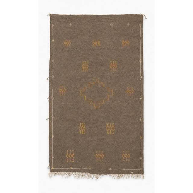 An understated and highly decorative vintage Moroccan Berber kilim rug, handwoven in Morocco during the mid-20th century,...