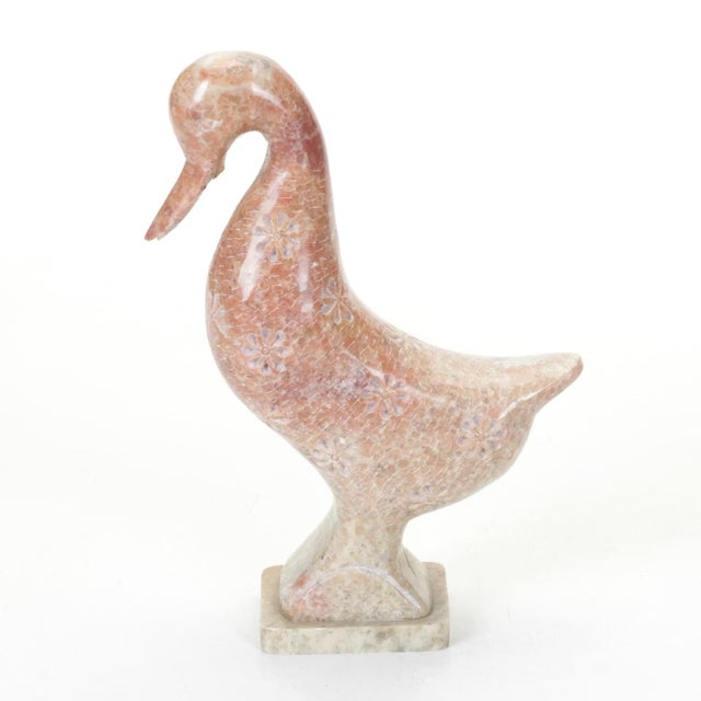 This vintage Mid-Century Modern style soapstone duck is carved with an array of flowers. It's in solid and sturdy condition.