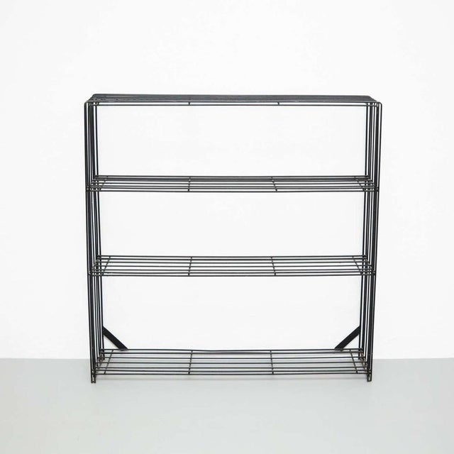 Minimalist black metal bookshelves. By unknown manufacturer, Netherlands, circa 1960. In original condition, with minor...