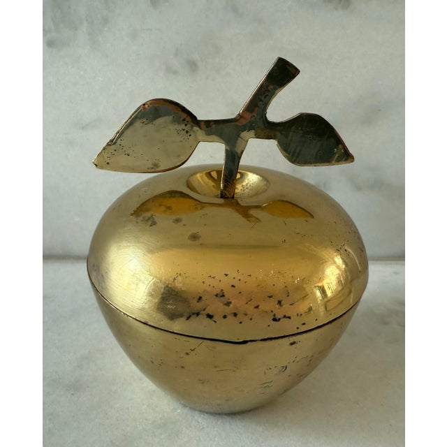 Vintage mid century modern brass apple trinket dish with a lid and leafed stem handle.