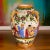 A stunning vintage Italian majolica decorative ceramic vase with three handles decorated with a colorful hand-painted,...