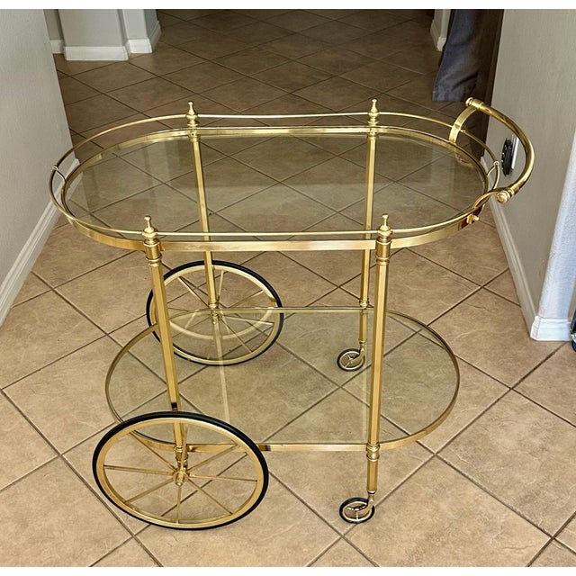 Larger scale Italian Neo-Classic style 2-tier brass bar (or tea cart) with inset glass shelves. Has a "made in Italy" label.