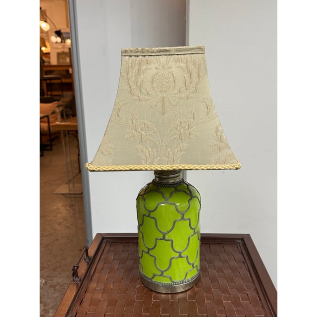 Design Plus Gallery presents a Ceramic Filigree Table Lamp from Anthropologie. The cylindrical ceramic body is coated in a...