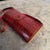 A 1970s Textured Red Leather and Brass Italian Shoulder Bag For Sale - Image 9 of 12