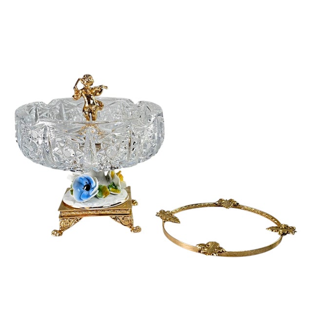 A sumptuous blend of Baroque grandeur and Regency elegance, this crystal pedestal brass ashtray captivates with its...