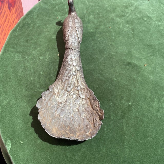 Beautiful metal peacock sculpture. This piece also has a removable lid which is the head. Perfect for the interior...