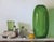 Green Glass, ca. 2015 by Cecilia Thorell | Oil on Linen Panel Still life with green glass and lemon For Sale