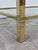 Mid-Century Modern set of brass table and console table with glass Measurements: Console: H 22.24in, W 29.92in, D 14.17in...