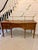 A refined antique Edwardian serpentine sideboard, finely constructed in figured mahogany and enriched with satinwood...