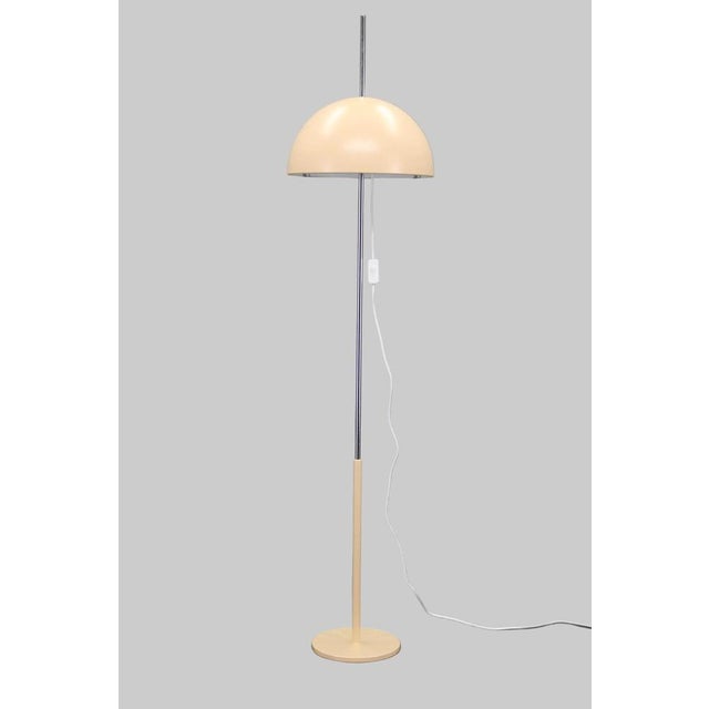 Iconic 1970s mushroom floor lamp with an adjustable dome shade, combining functional design with a clean Space Age...