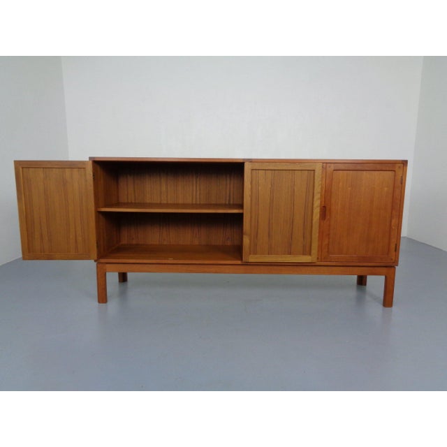 High-quality Danish sideboard by Vitré in teak. Four doors. Six drawers on the left. One shelf on the right. Very nice,...