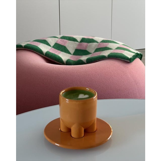 A sculptural cappuccino cup and saucer set designed with clean lines, simple geometry, and a compact, elegant form. The...