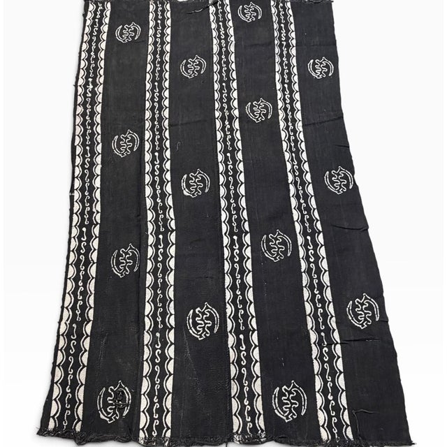 Vintage hand weaving from 100% cotton, this authentic mud-cloth textile is made by the skilled artisans of the Bamana...